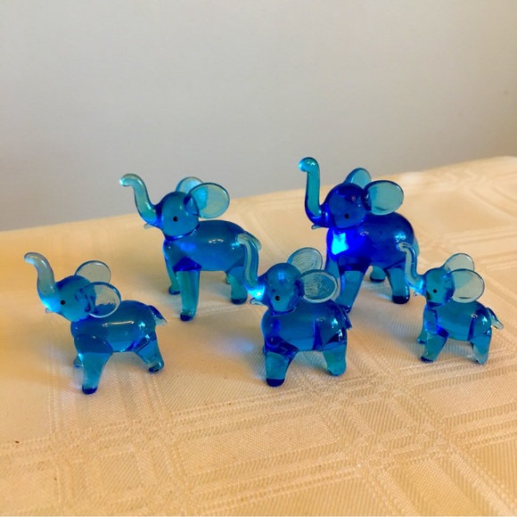 Other - A family of five blue blown glass elephants with trunks raised for luck.